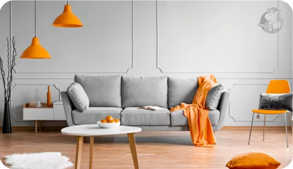 szary salon z pomarańczowymi akcentami